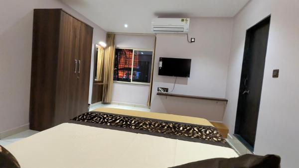 Amrut Inn, Boek  Māvalli Karnataka